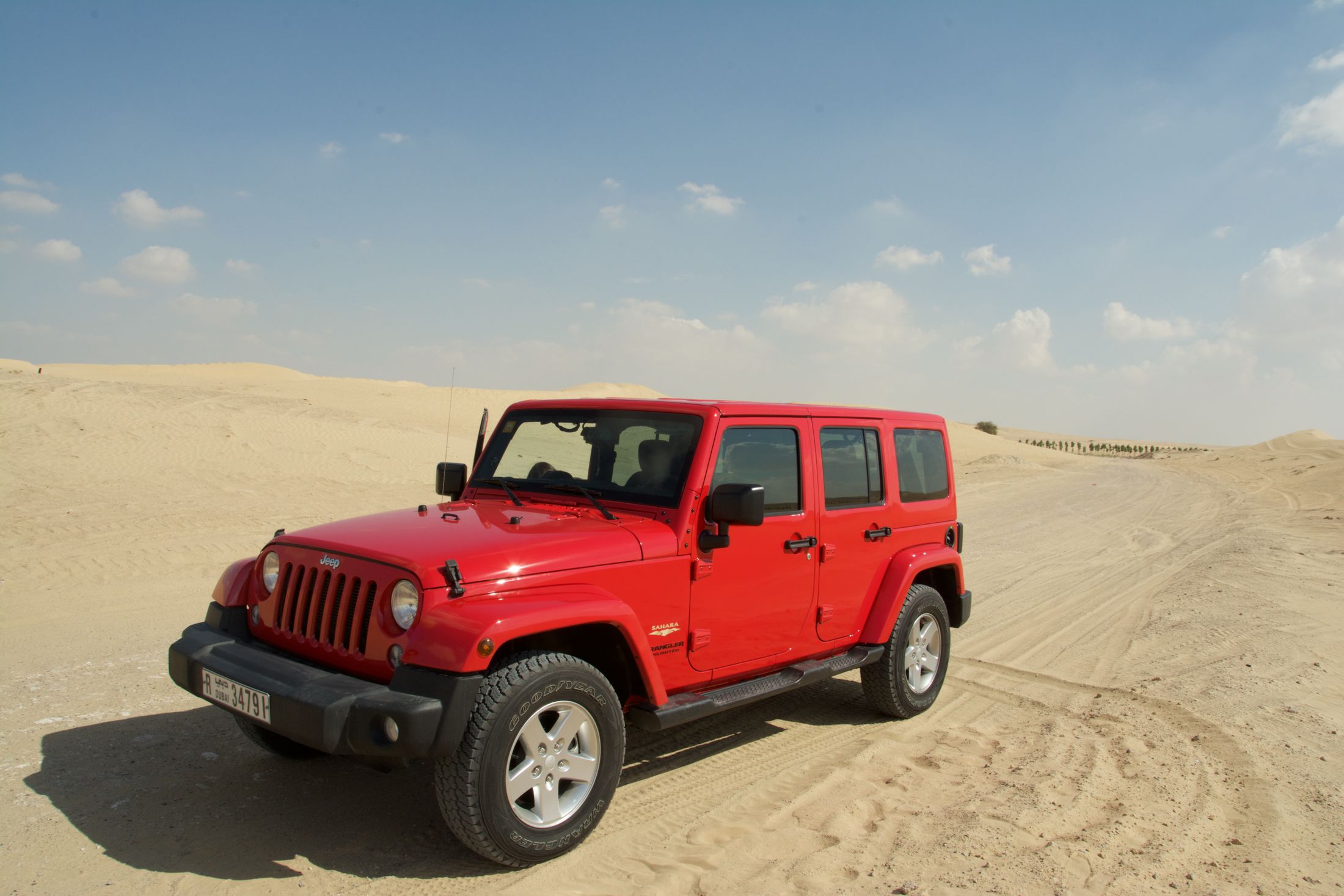 Red four-wheel-drive vehicle ready for a Dubai desert safari